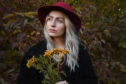 Photo Of Woman Holding Plant