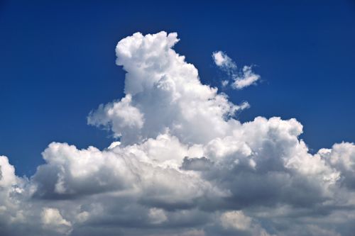 Free Dramatic cumulus clouds rising against the blue sky in Sarasota, Florida. Stock Photo