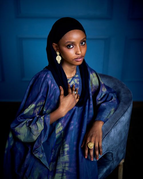 Free Striking portrait of a woman in vibrant traditional wear, showcasing elegance and cultural beauty. Stock Photo