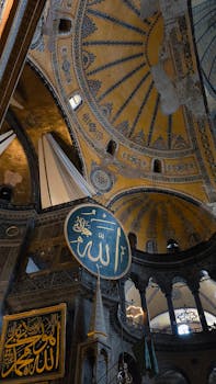 Intricate details of Hagia Sophia's iconic dome in İstanbul showcase historical architectural artistry.