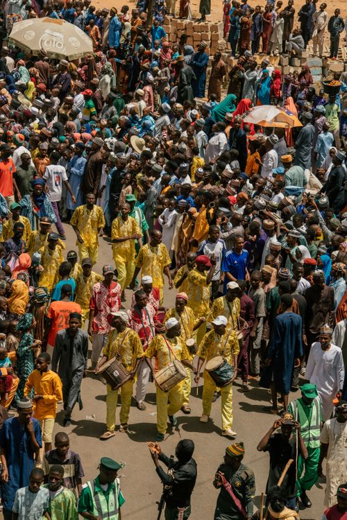 Free A vibrant street parade with participants in traditional attire in Nigeria. Stock Photo