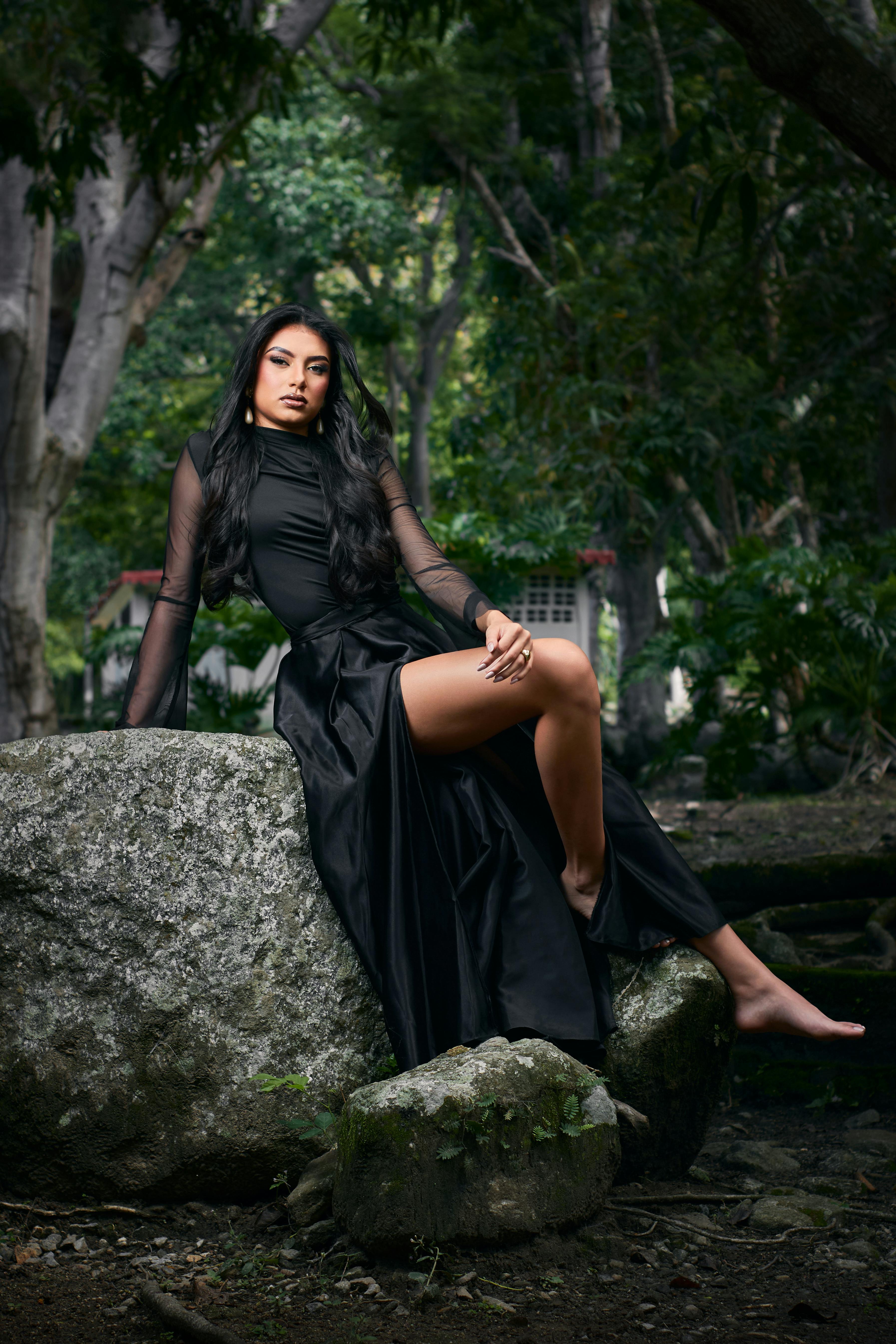 Elegant Woman in Black Dress Posing Outdoors  Free Stock Photo