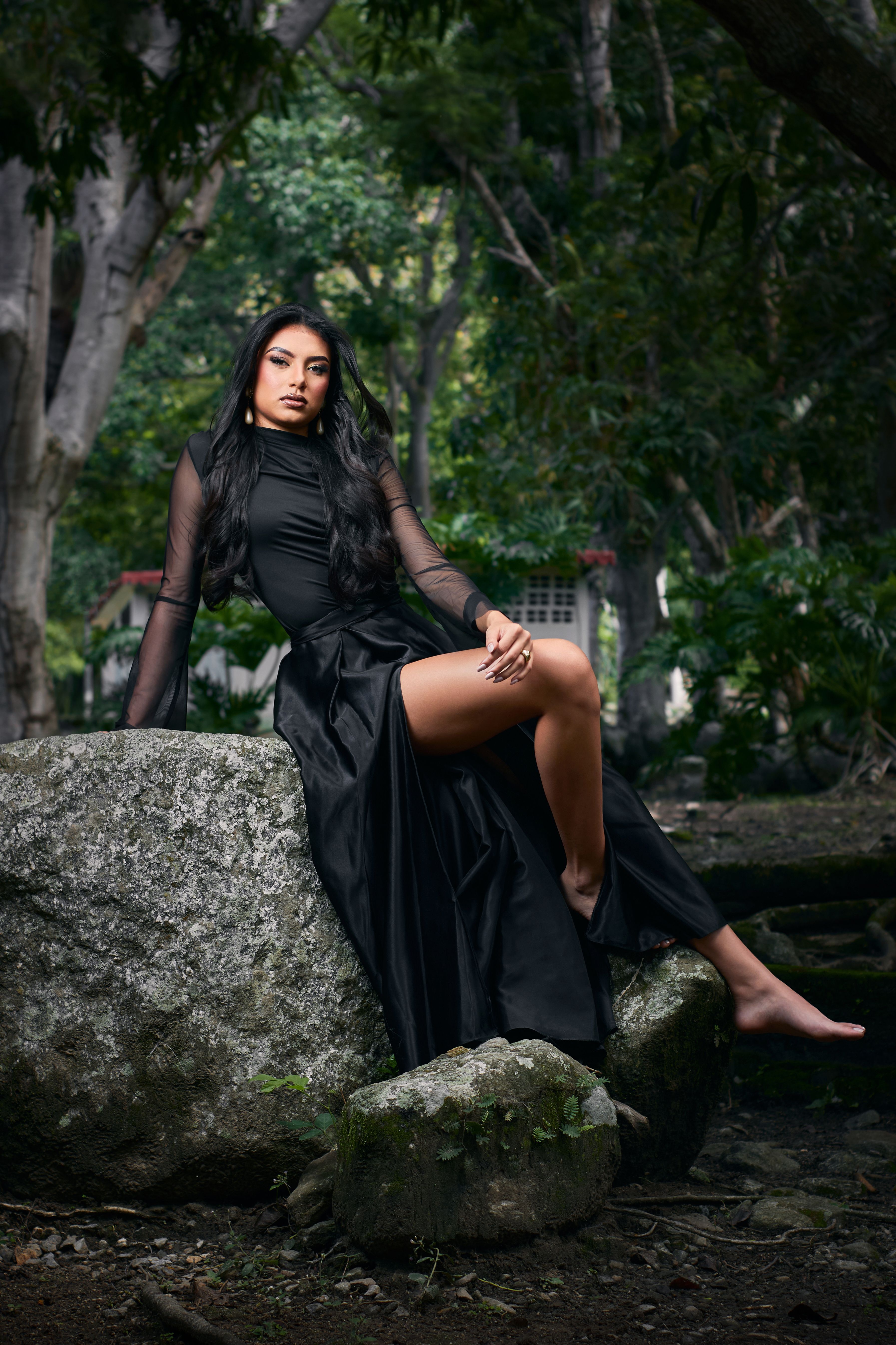 Elegant Woman in Black Dress Posing Outdoors  Free Stock Photo