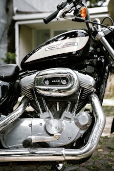 Detailed view of a Harley-Davidson 1200 engine with chrome details outdoors.