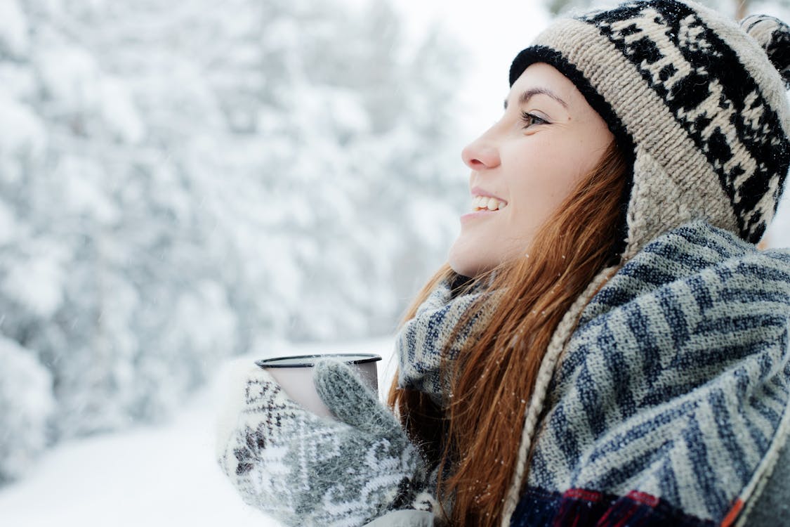 Photo Of Woman Wearing Knitted Gloves