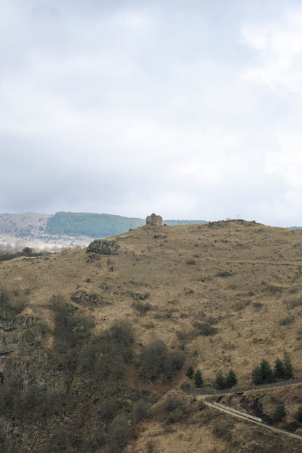 A group of people participating in a cooking class, preparing ingredients on a large wooden table.