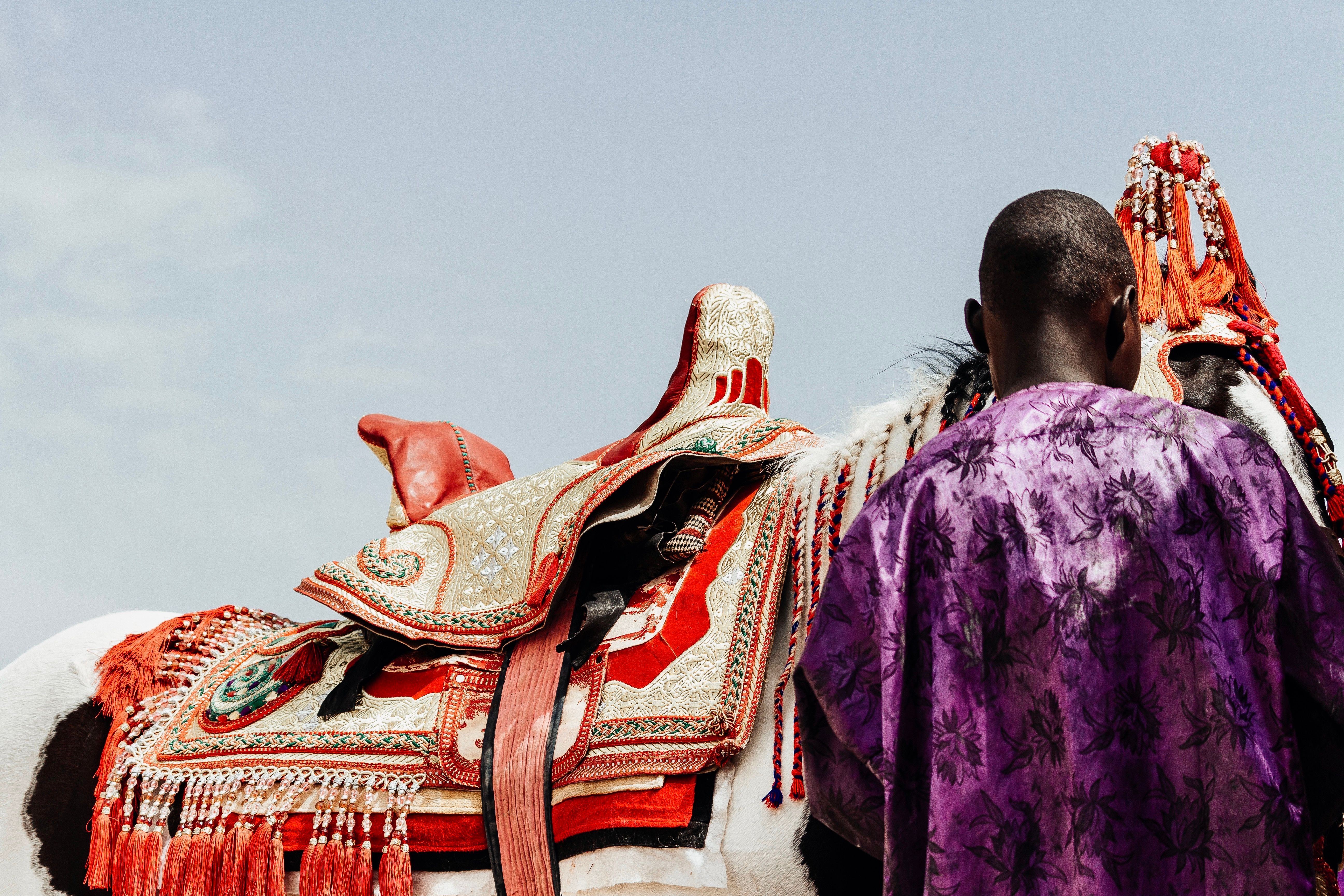 African Horse Rider in Traditional Attire · Free Stock Photo