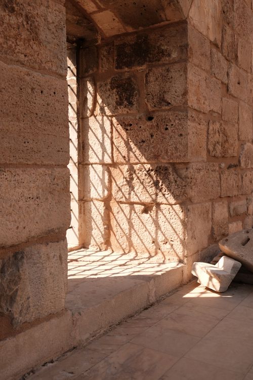 Free Sunlight casting shadows through an ancient stone archway in Selçuk, Türkiye. Stock Photo