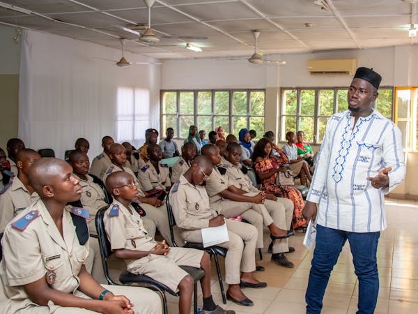 African students with teacher in classroom