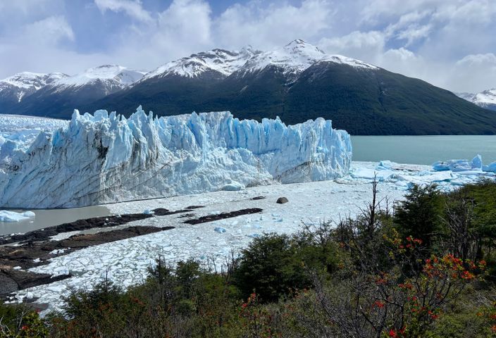 Majestic Perito Moreno Glacier with snow-capped mountains in Patagonia, Argentina.
