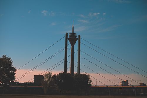 Free Silhouette of Rheinturm Tower and bridge at dusk in Düsseldorf, Germany. Stock Photo