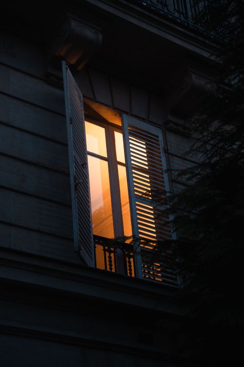 Open Window At Night Cozy Warm Light from an Open Window at Night ยท Free Stock Photo