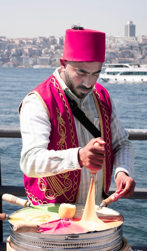 Free A traditional Turkish vendor making colorful ice cream on the Bosphorus shore. Stock Photo