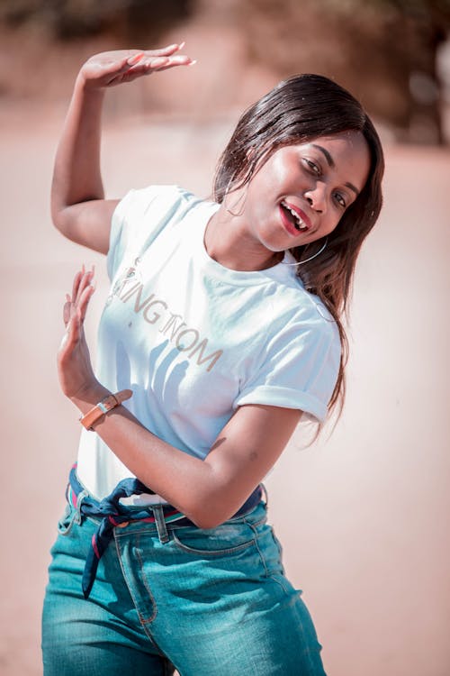 Woman Wearing White Crew-neck T-shirt Dancing