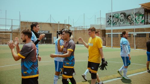 Free Casual soccer game with diverse players on a sunny day Stock Photo
