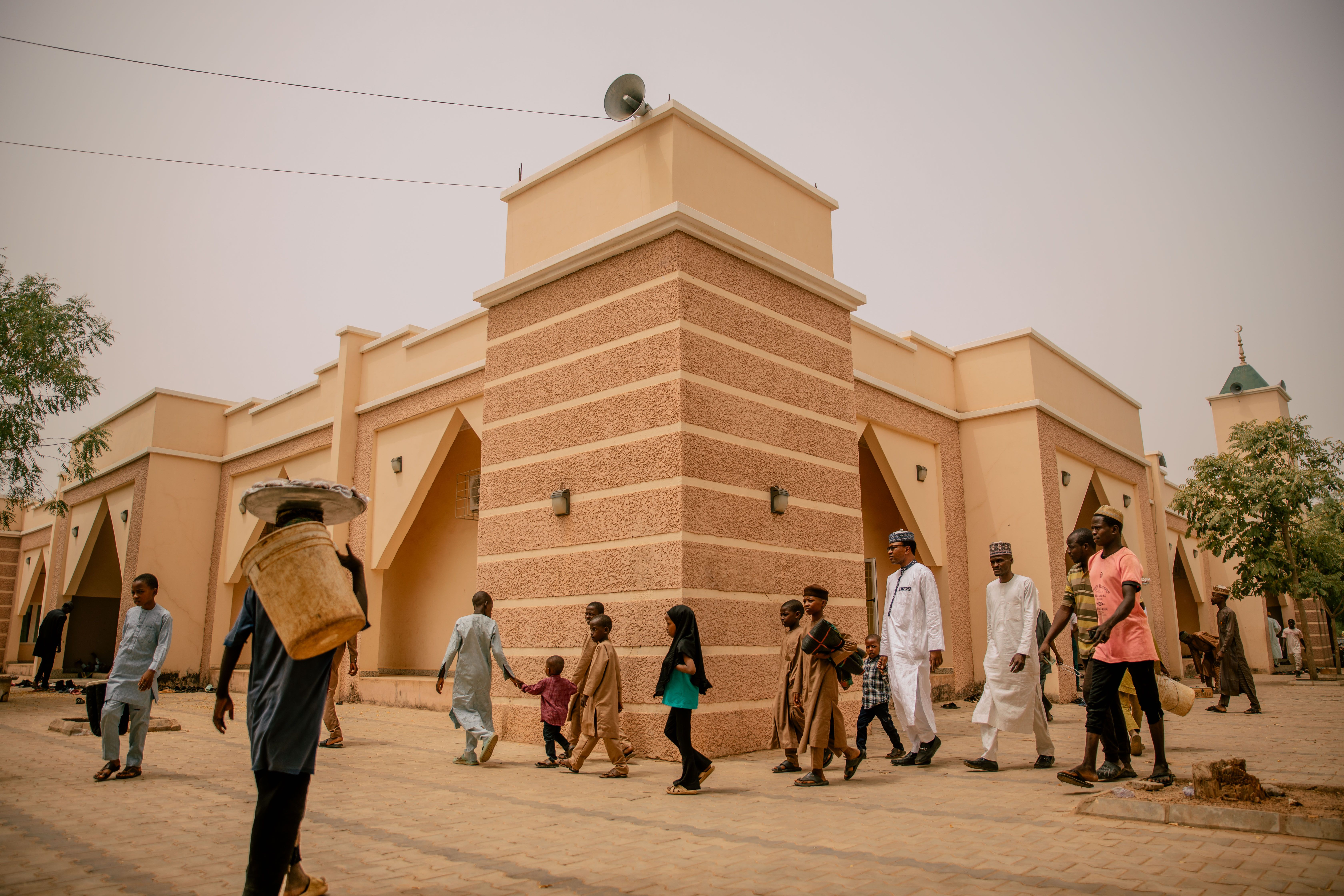 People Walking Near Modern Mosque Architecture · Free Stock Photo