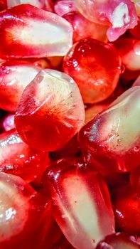 Vibrant macro shot showcasing the fresh and juicy texture of red pomegranate seeds.