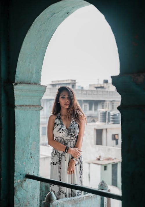 Photo Of Woman Standing On Balcony