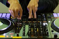 Mixing Music: DJ Hands on Turntable