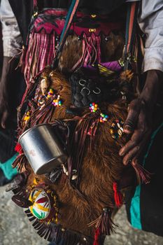 Vibrant traditional wear adorned with colorful beads and decorations, capturing cultural essence in Kano, Nigeria.