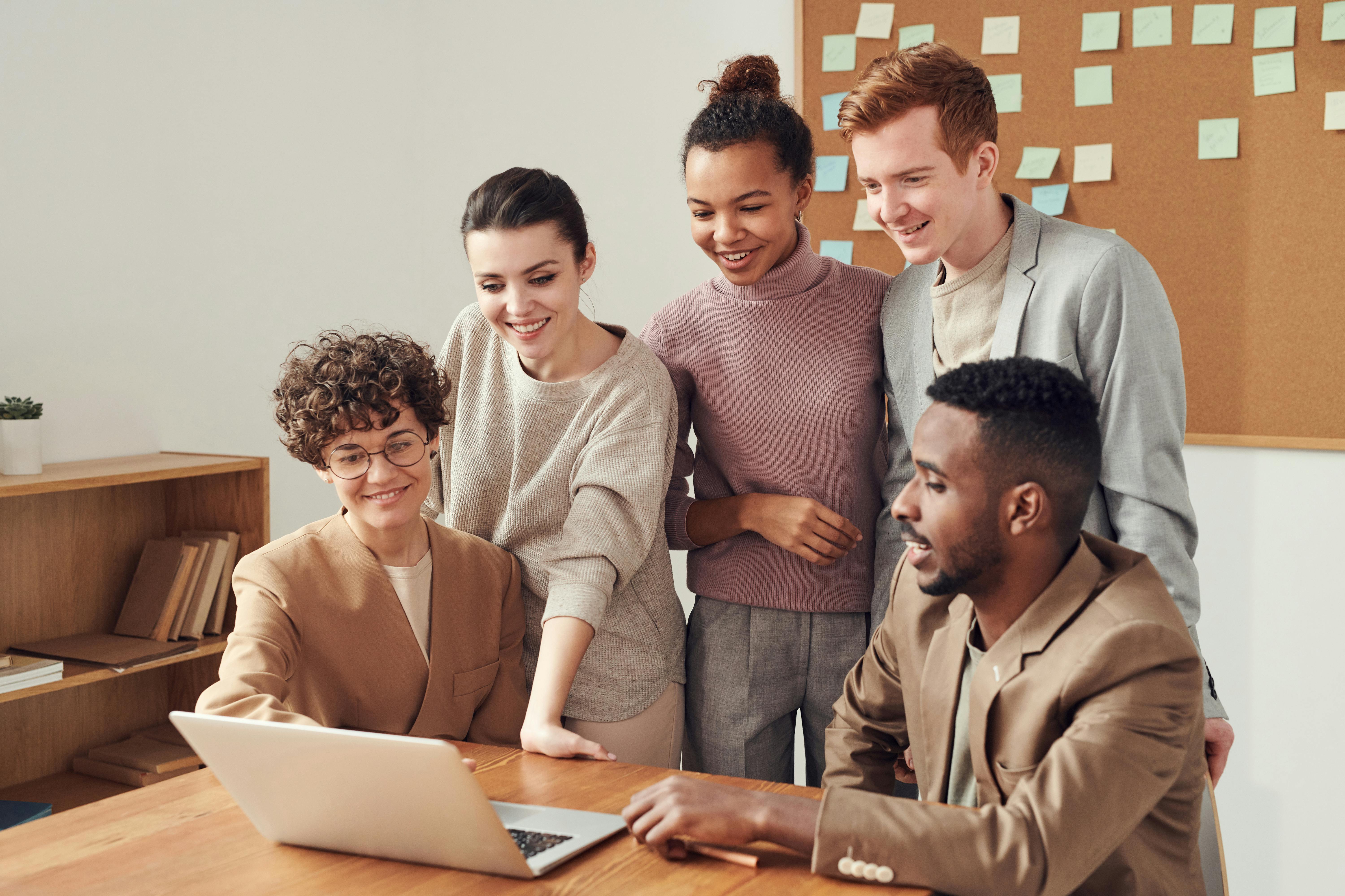 Photo Of People Looking On Laptop · Free Stock Photo