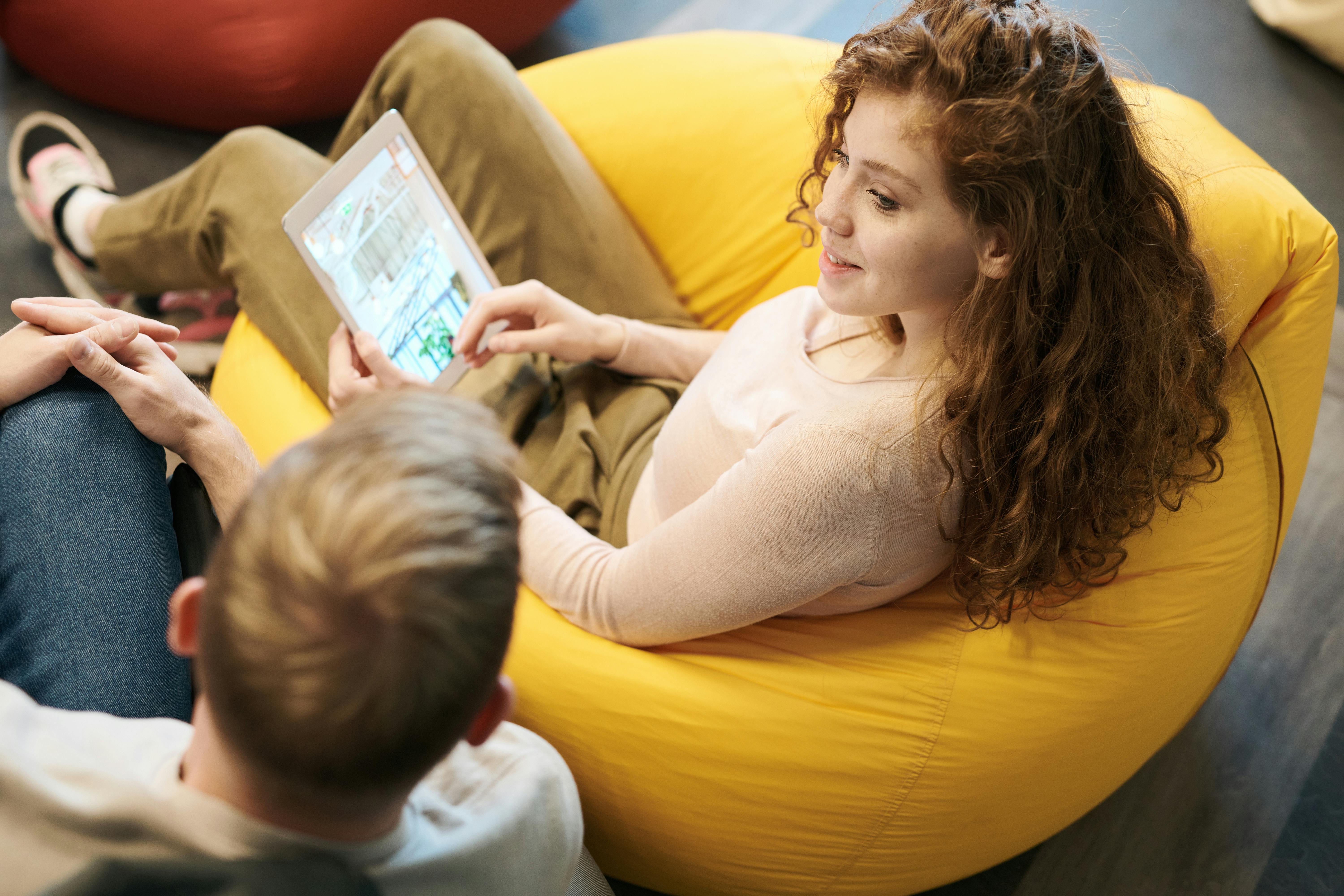 Photo Of Woman Sitting On Bean Bag Chairs \u00b7 Free Stock Photo