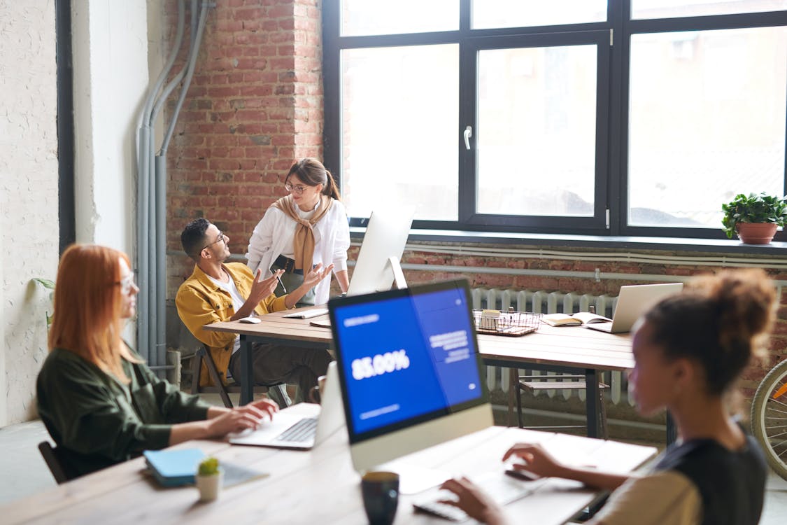 Free People Working in front of Computer Stock Photo