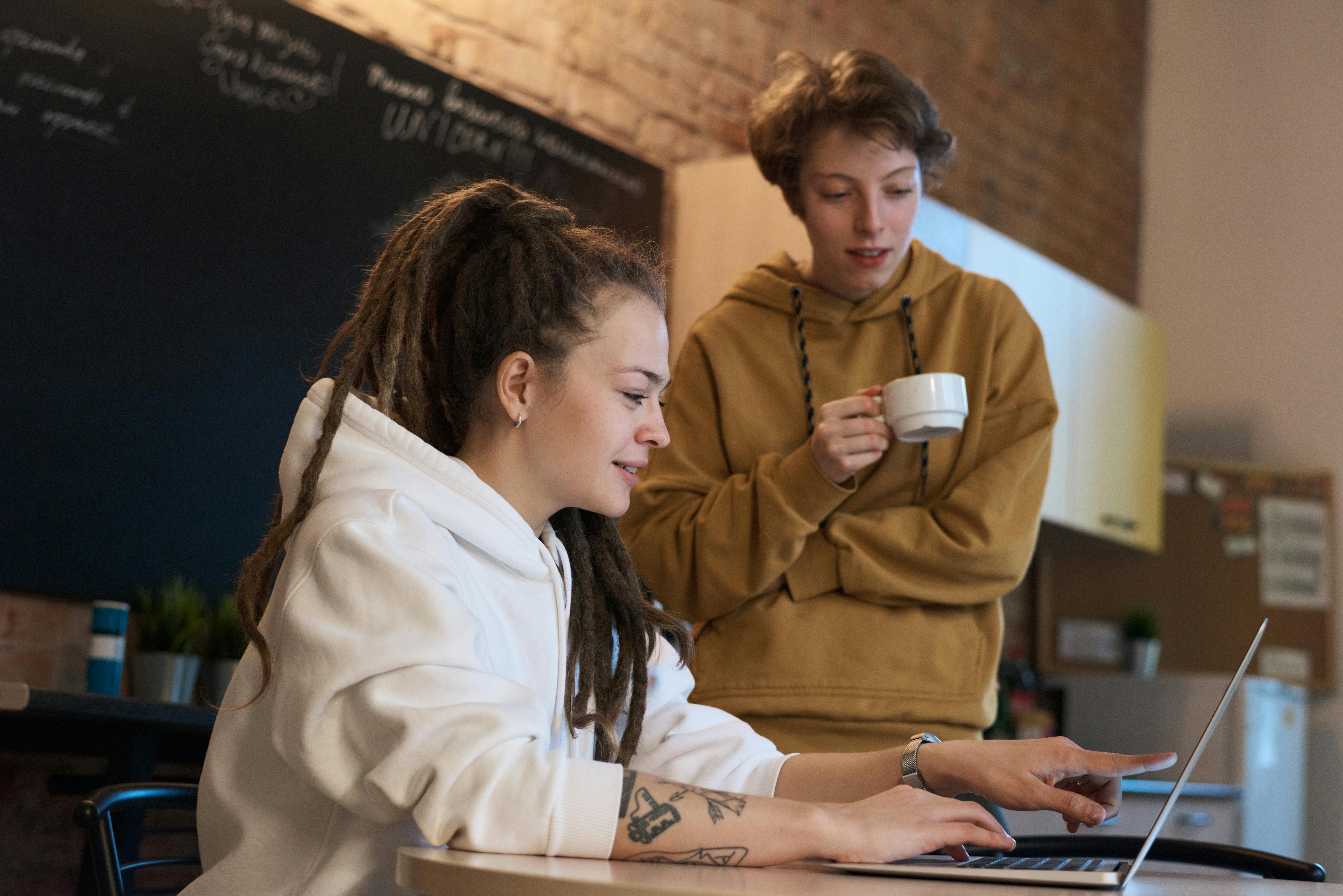 Photo Of People Looking On Laptop