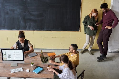 Free Photo Of People Near Blackboard Stock Photo