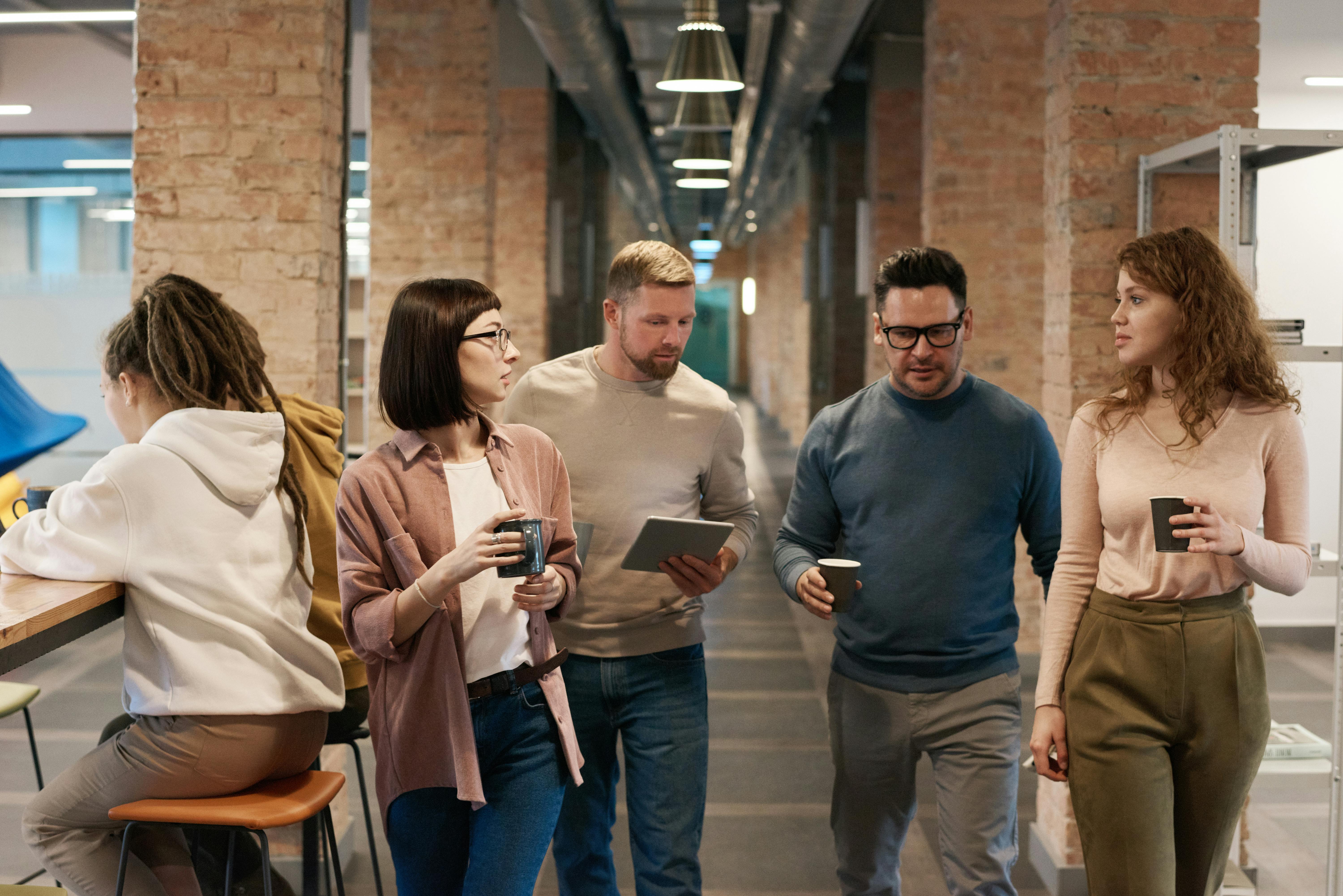 photo of people walking on hallway