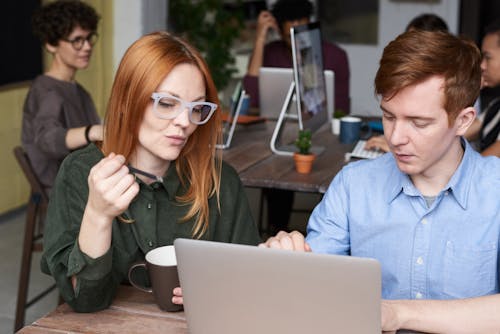 Photo Of People Looking On Laptop