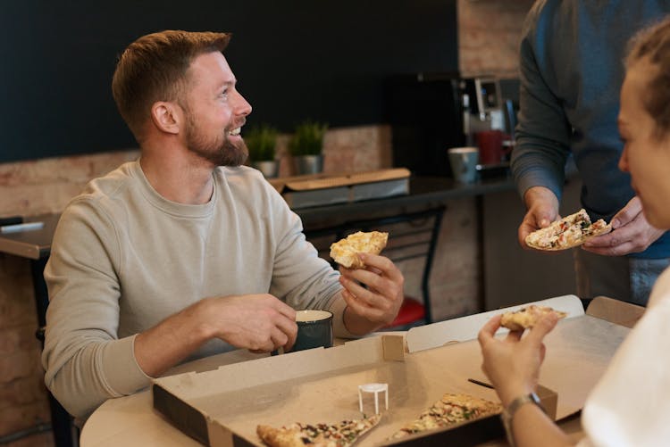 Man Eating Pizza