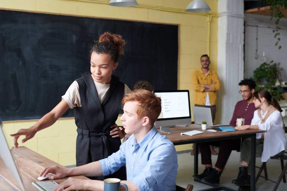  Photo Of Woman Pointing On Computer