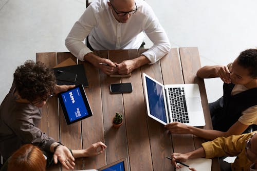 Top View Photo of People Having a Meeting