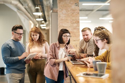 Free Shallow Focus Photo of People Discussing Stock Photo