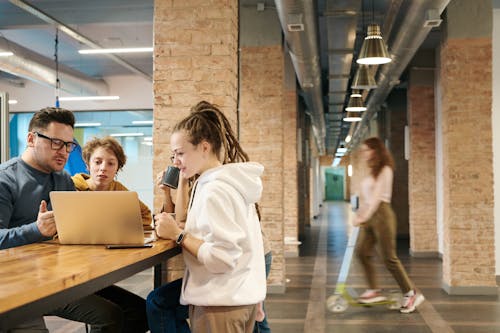 Free Photo Of People Looking On Laptop Stock Photo