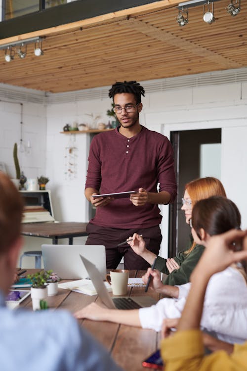 Free Photo Of Man Standing In Front Of People Stock Photo