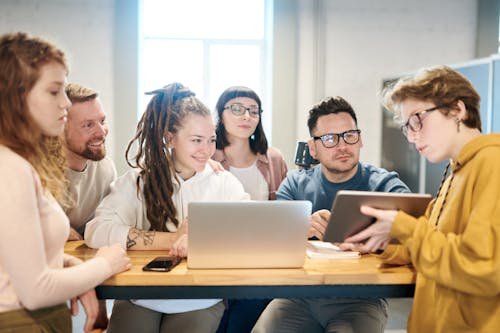 Free Photo Of People Looking On Tablet Stock Photo