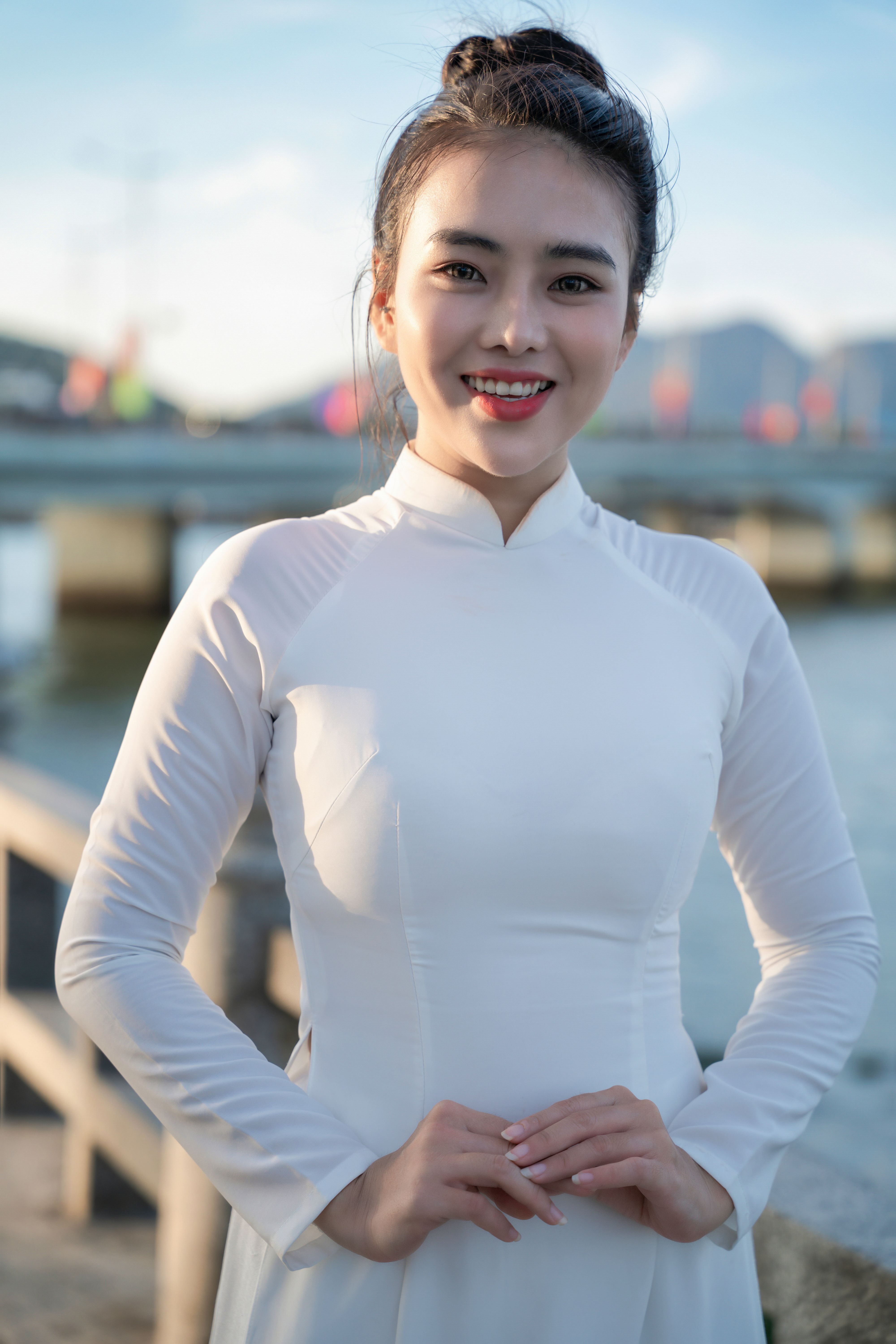 Smiling Woman in Traditional Dress by River · Free Stock Photo