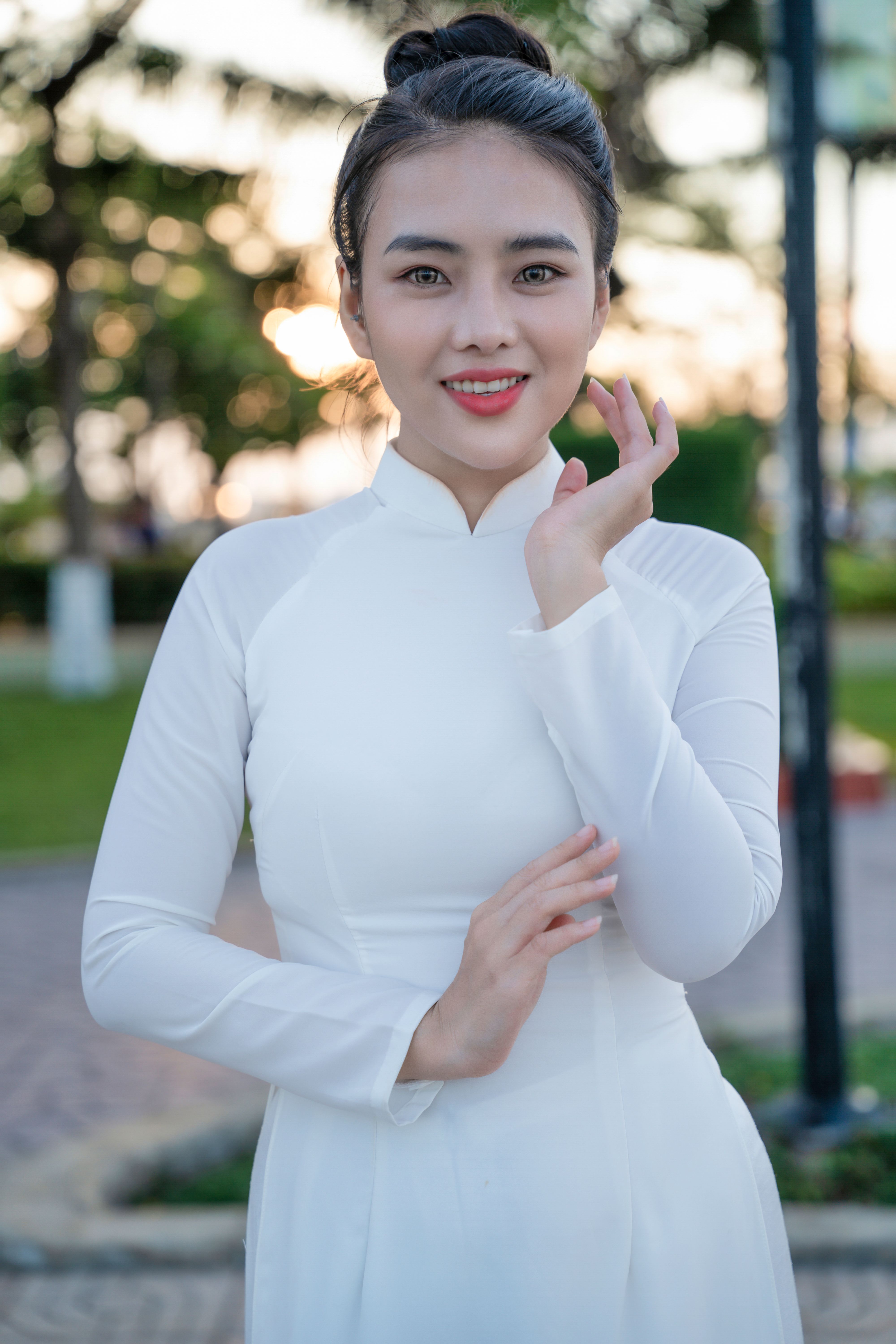 Portrait of Young Woman in Traditional Dress Outdoors · Free Stock Photo