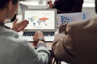 Man Pointing at Computer Display