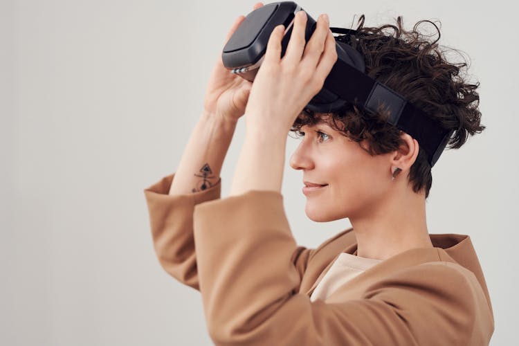 Woman Holding VR Goggles 