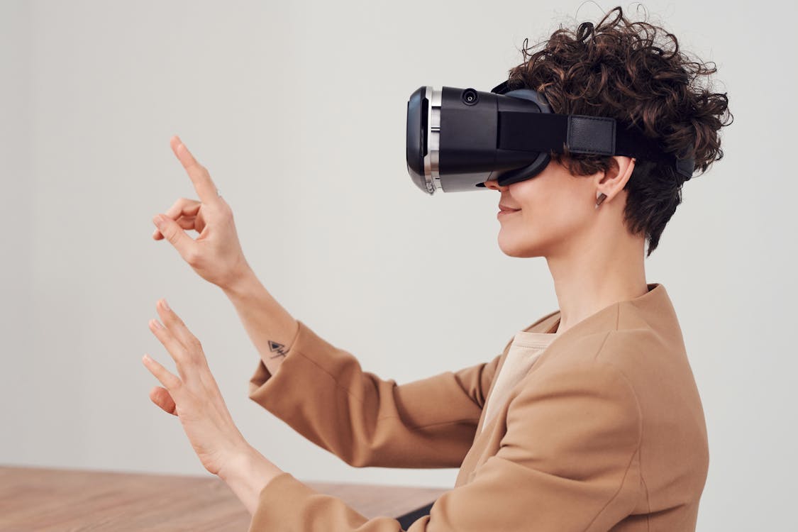 Person Using Virtual Reality Goggles Free Stock Photo