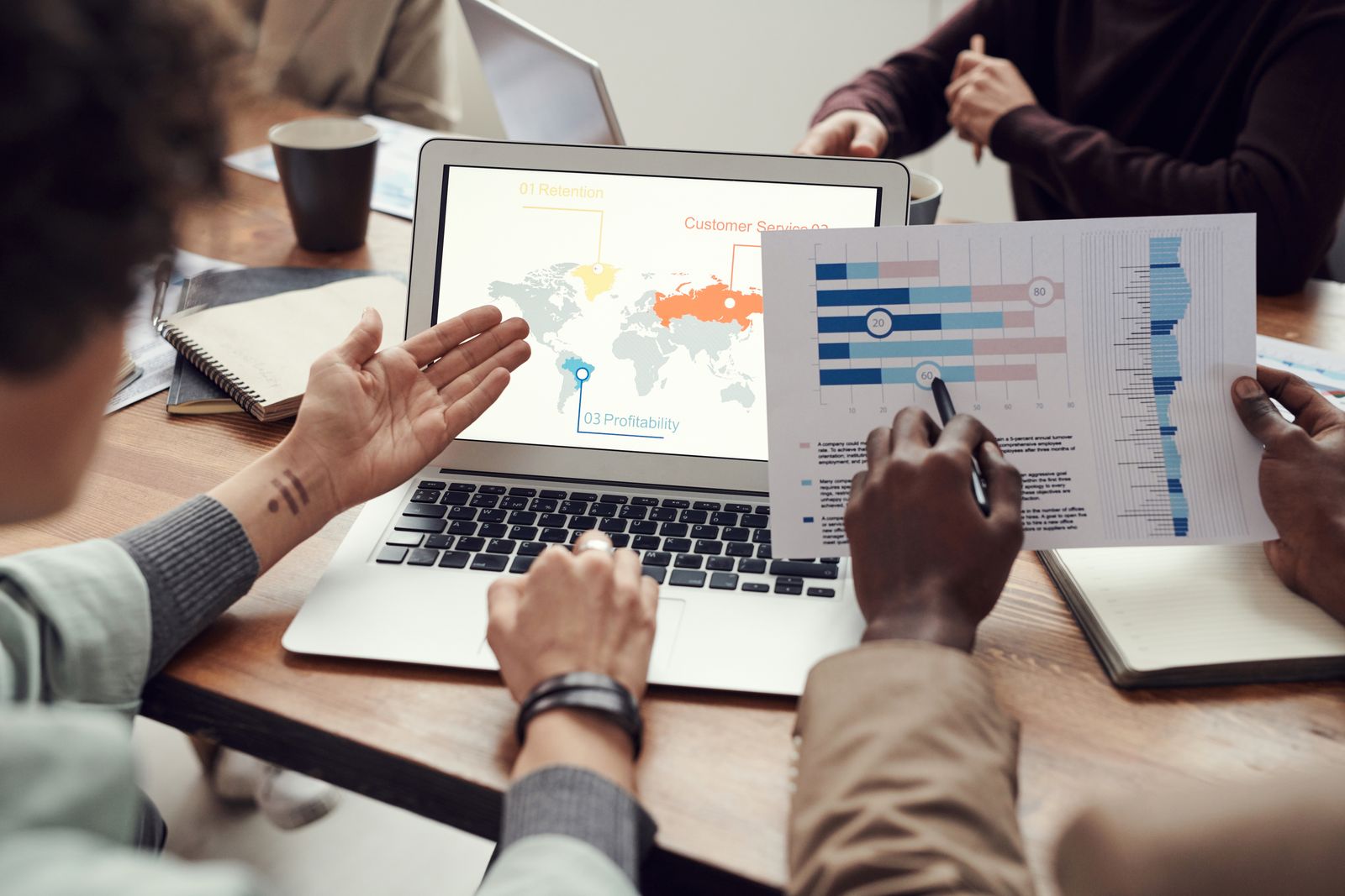A diverse team of professionals collaborating in a modern meeting room