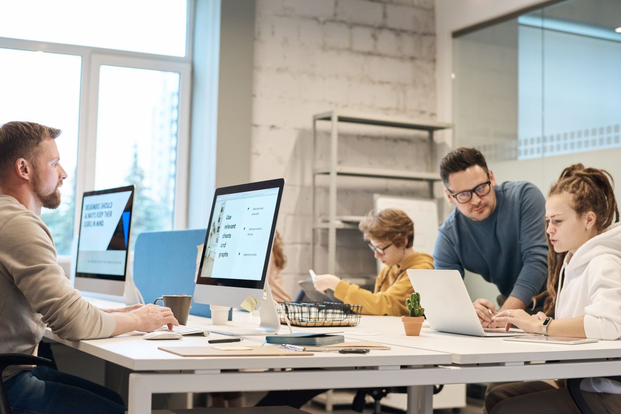 Team of professionals discussing project ideas in a modern office