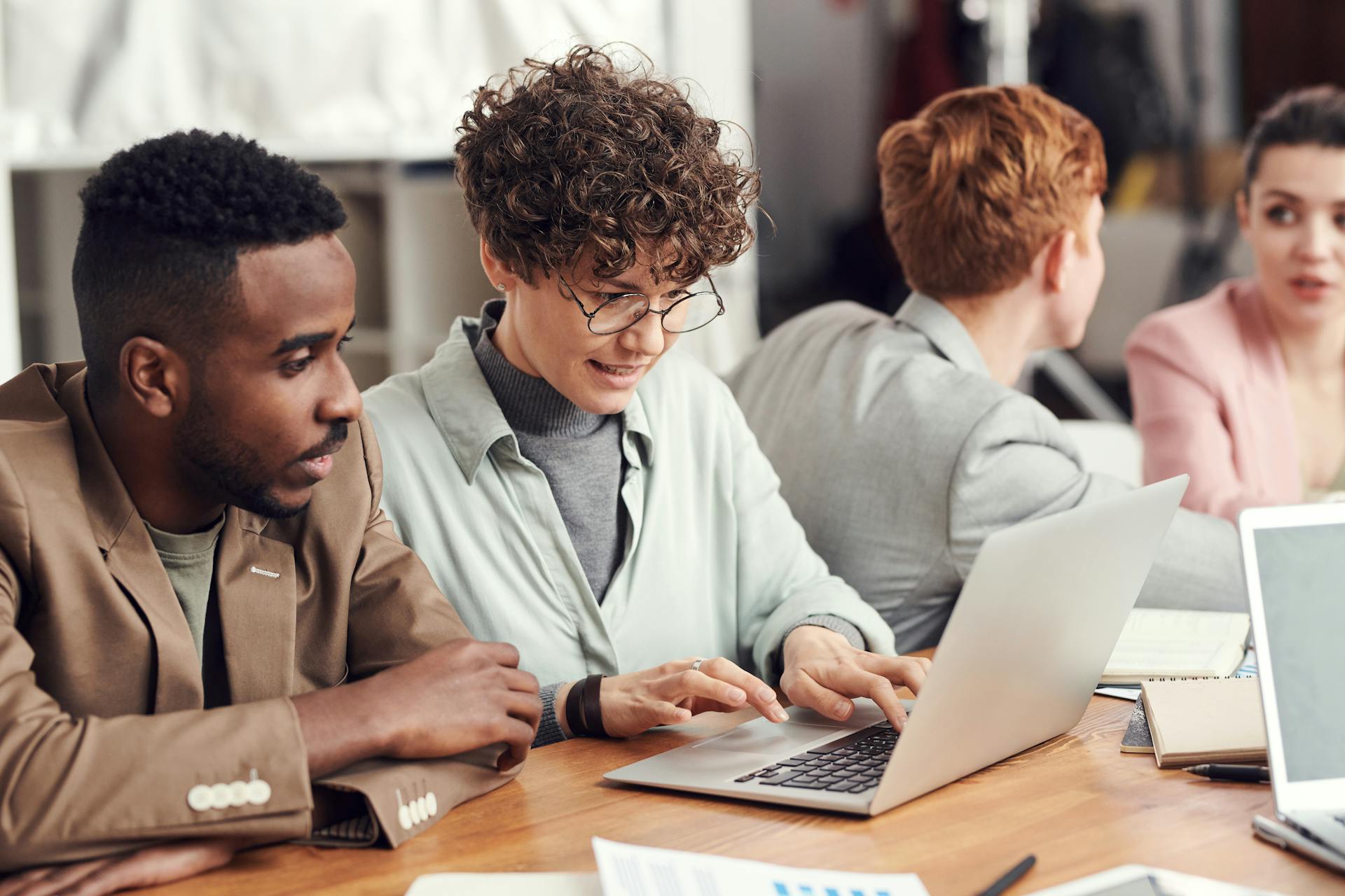 Photo Of People Looking On Laptop