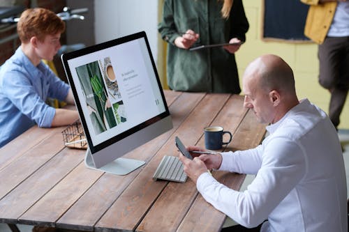 Photo Of Man Using Smartphone