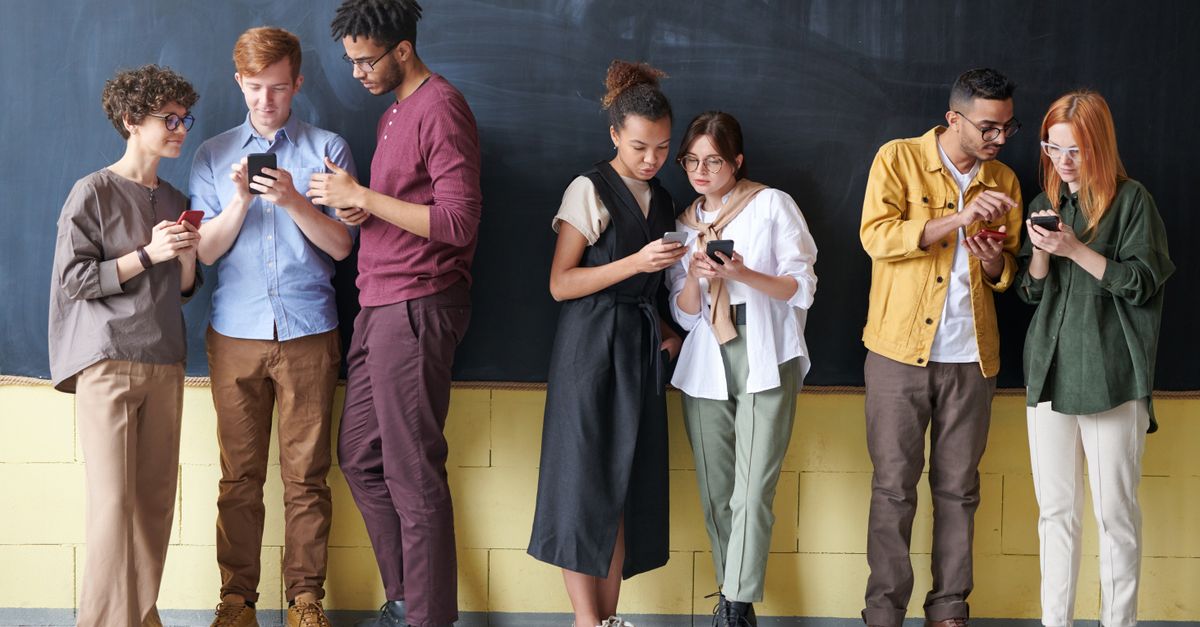 A diverse group of Gen Z individuals on phones, some with headphones, in a park or cafe, not a church