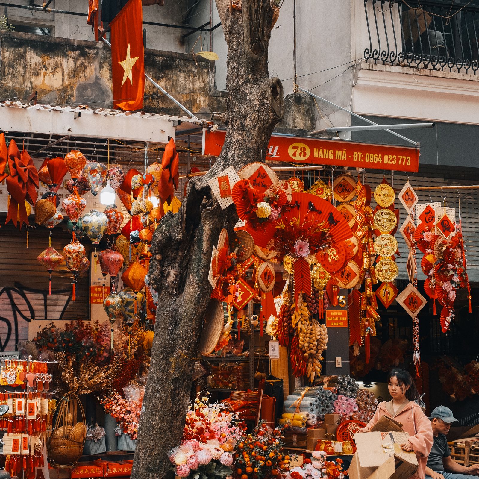 Colorful festive street market in Hanoi during Vietnamese Lunar New Year Tet