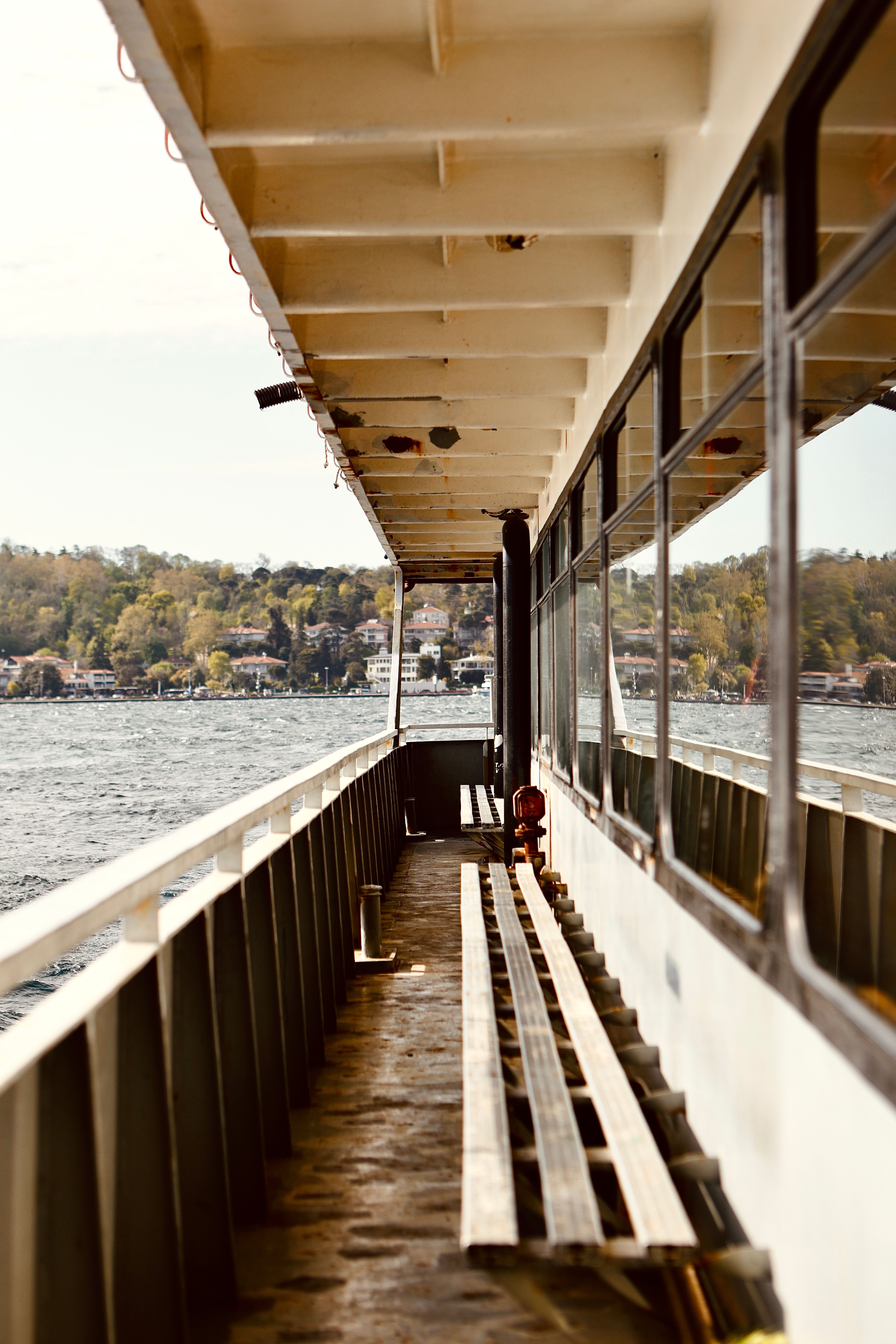 Scenic Ferry Ride on a Serene Lake · Free Stock Photo